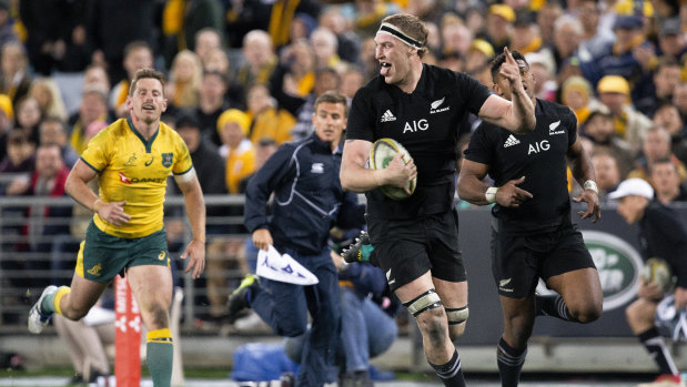 Taunted: Brodie Retallick celebrates as he runs in one of the final nails in the Wallabies' coffin.