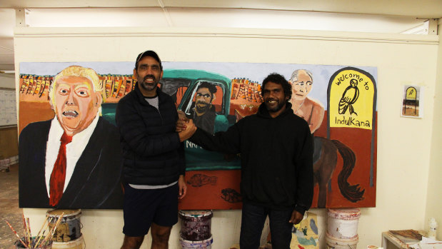 Adam Goodes and Vincent Namatjira when Goodes visited Indulkana in 2018.