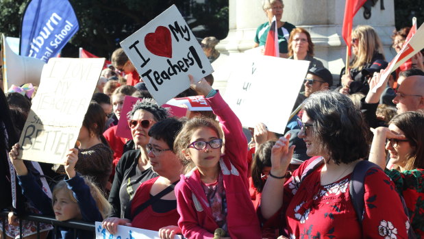 Teachers and students take to the streets of Wellington for a "mega-strike" over a long-running pay dispute with the NZ government.