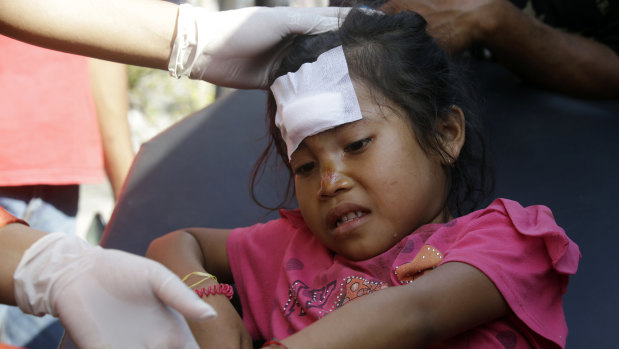 An girl injured from the earlier earthquake at Mataram, Lombok.
