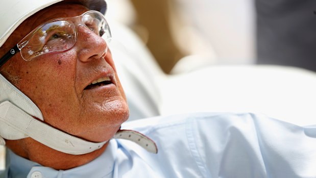 Sir Stirling Moss sitting in his Mercedes before driving up the hill at Goodwood on June 27, 2015. 