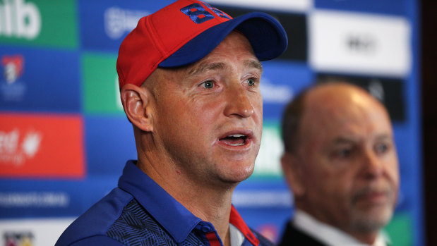 Fronting up: Nathan Brown addresses the media with Knights boss Phil Gardner on Wednesday morning after revealing he would be stepping down at the end of the season.