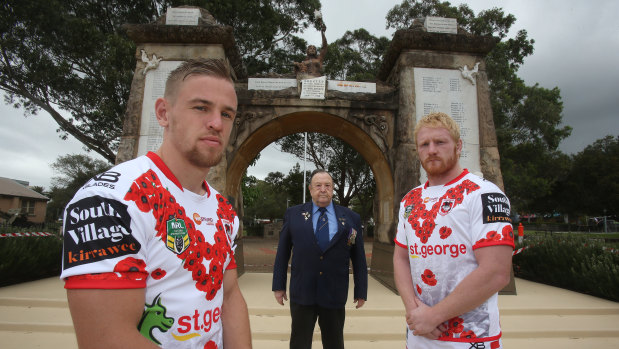 Lest we forget: Dragons' Matt Dufty (left) and James Graham pay their respects with Doug Johnston at the Cenotaph in Wollongong.