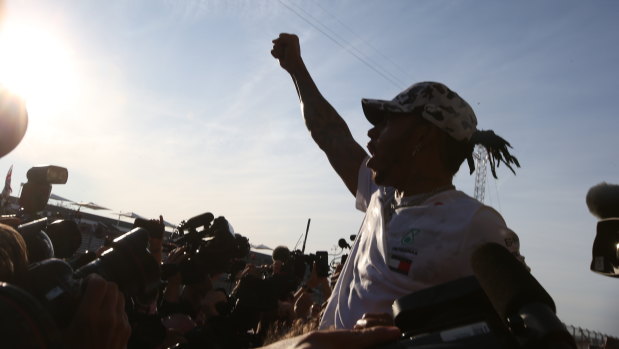 Lewis Hamilton celebrates his sixth world championship.