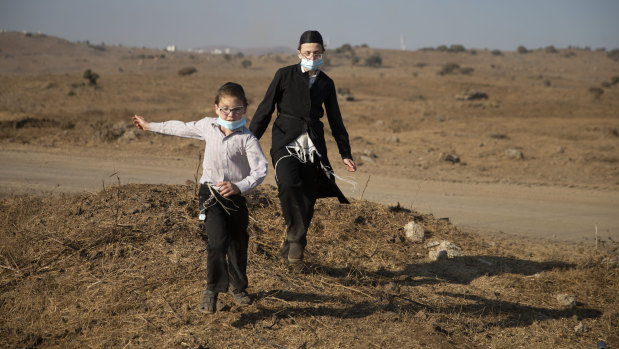 Ultra-Orthodox Jews wearing protective face mask amid concerns over the country’s coronavirus outbreak.