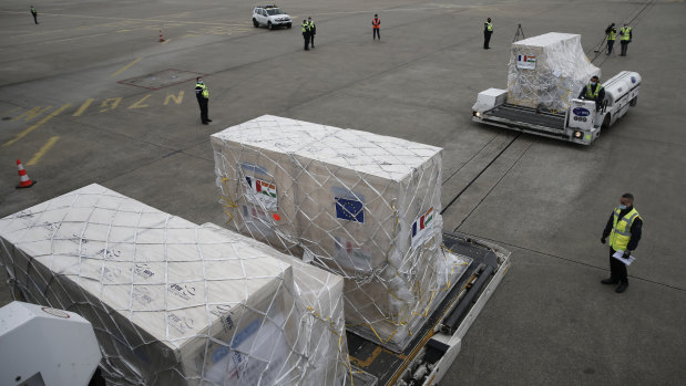 Medical supplies and materials are loaded into a cargo plane to India at Roissy airport, north of Paris on Saturday. 