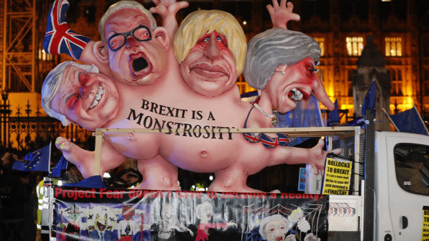 An anti-Brexit effigy is driven around Parliament square after the results of the vote are made public.
