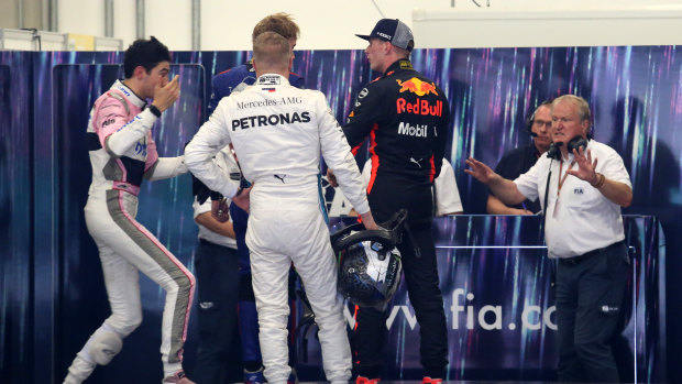 Heating up: Red Bull's Max Verstappen and Esteban Ocon (left) clash in the weigh-in room.
