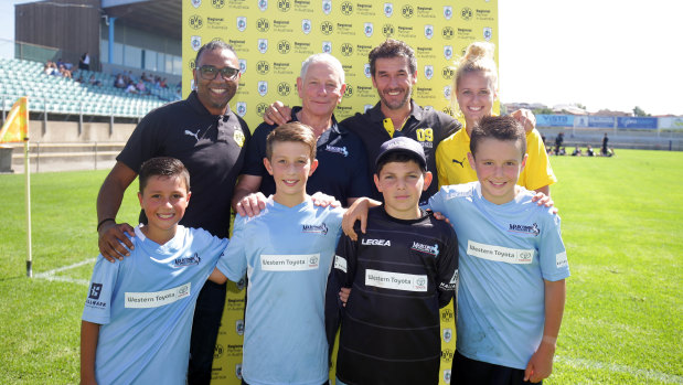 Dortmund regional managing director Suresh Letchmanan (back row, left) and ambassador Karl-Heinz Riedle (back row, third from left) with Marconi representatives. 