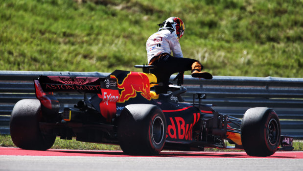 Daniel Ricciardo hops out of his Red Bull after engine failure in Austin.