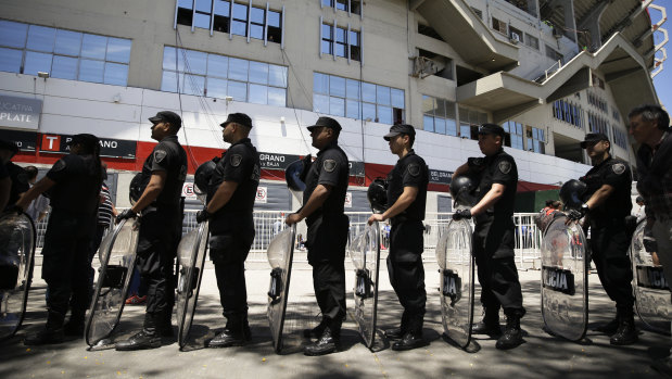 Riot police outside the stadium where the Copa Libertadores final was to be held.