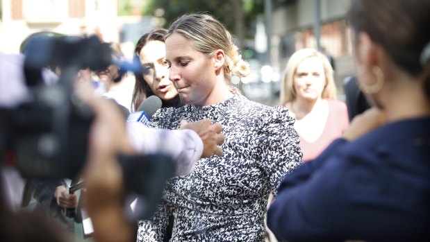 Maddie Beale leaves Parramatta Bail Court on Saturday. The couple had recently returned from France and welcomed the birth of their first child.