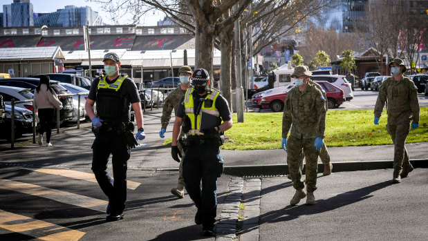 Victoria police and ADF personnel patrolling Melbourne CBD during the stage four lockdown.