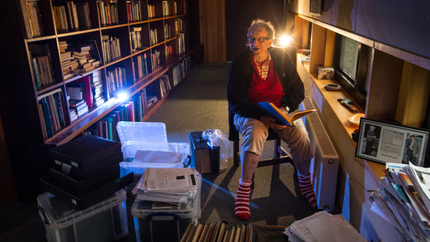 Long-time barrister Brian Bourke in his office wearing his Swans football socks. 