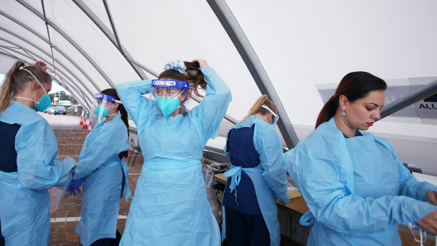 Nurses prepare to conduct COVID-19 tests at Bondi Beach testing clinic in Sydney. 