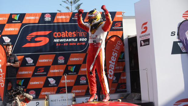 Champion: Scott McLaughlin celebrates on his car after clinching the Supercars title.