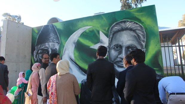 The crowd at the opening of the striking mural on the Pakistan High Commission in Canberra.