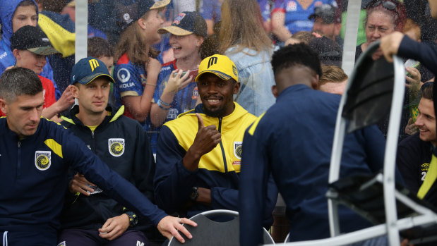 Main attraction: Usain Bolt in the dugout with the Mariners in Maitland.