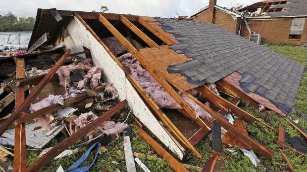 A roof that was blown off a home rests on the ground in Hamilton, Mississippi, after a deadly storm on Sunday.