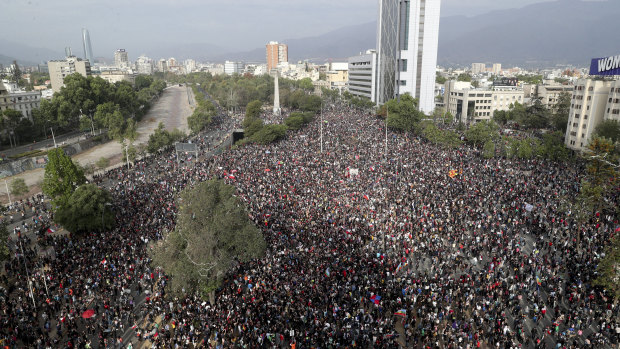 Demonstrators protest against the government in Santiago, Chile, again on Monday.