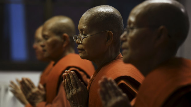 Nightly prayers at the Songdhammakalyani Monastery, the first centre for female monks in Thailand. 