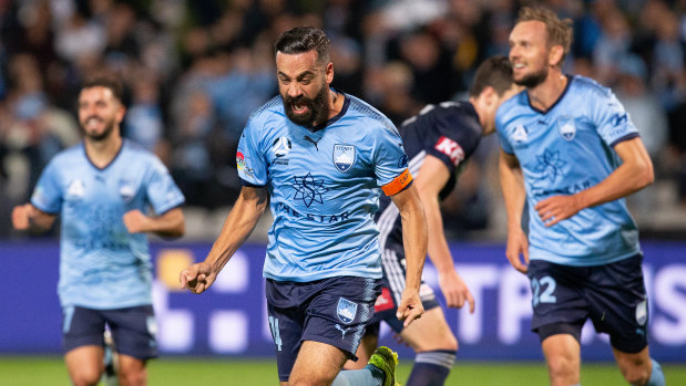 Sydney FC veteran Alex Brosque celebrates scoring the second goal of six for the now grand finalists. 