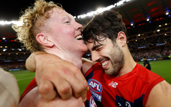 Midfield bulls Christian Petracca (right) and Clayton Oliver embrace.