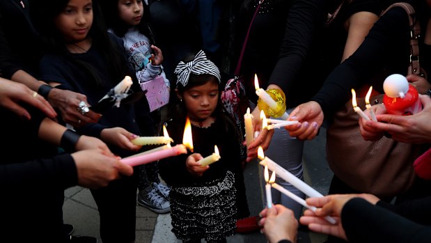 Mourners hold a vigil on Friday outside the presidential palace in Nicosia, Cyprus.