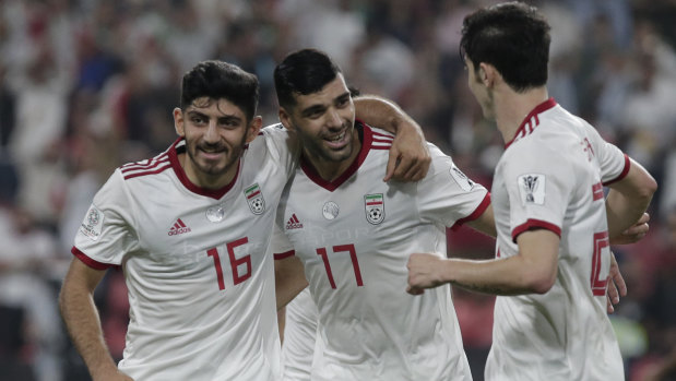 Another one: Iran's forward Mehdi Taremi, centre, celebrates after scoring his side's opening goal against Yemen.