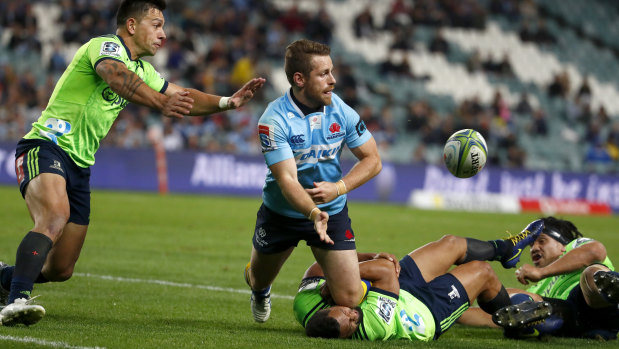 Drought-breaker: Bernard Foley offloads during the Waratahs' round 14 win over the Highlanders last year.