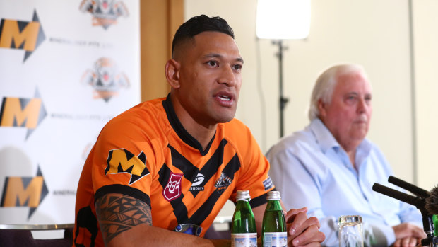 Israel Folau, pictured with backer Clive Palmer, said on Friday he was excited to return to the “grassroots level”.