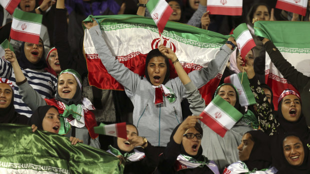Iranian women cheer for their team in October 2018, in a rare case of women being allowed into a stadium to watch soccer in the country.