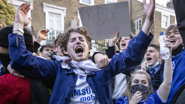 Chelsea fans celebrate their club’s withdrawal from the European Super League.