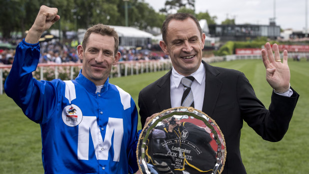 Winx jockey Hugh Bowman and  trainer Chris Waller hold the Queen of the Turf's fourth Cox Plate.