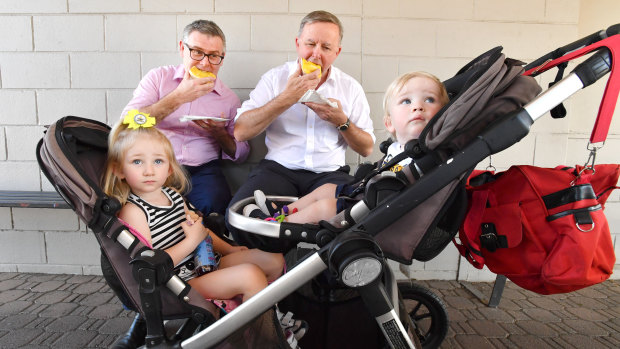 Shadow spokesperson for Northern Australia, Senator Murray Watt, and Opposition Leader, Anthony Albanese, on a tour of regional Queensland. They are pictured with Biloela children Ivyanne Millwood, 3, and her brother, Jack, 1.
