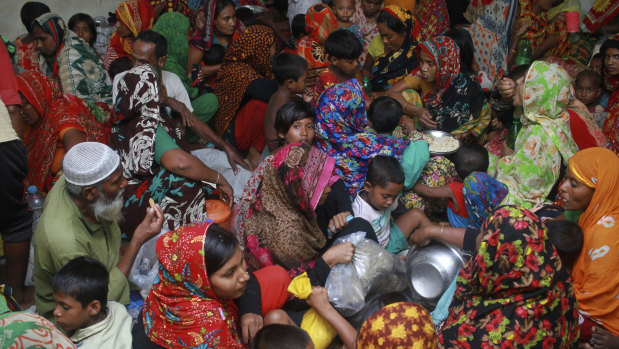 People crowd a shelter before Cyclone Amphan made landfall, in Shyamnagar, Shatkhira, Bangladesh. 