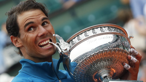 Nadal celebrates with the trophy.