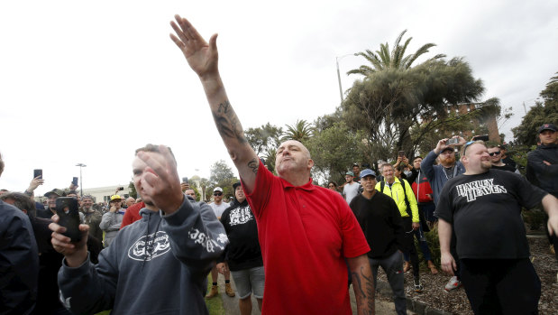 A protester issues a Nazi salute at Saturday's St Kilda rally.