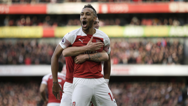 Double: Pierre-Emerick Aubameyang scored twice in a thrilling North London derby marred by racial abuse from Spurs fans.