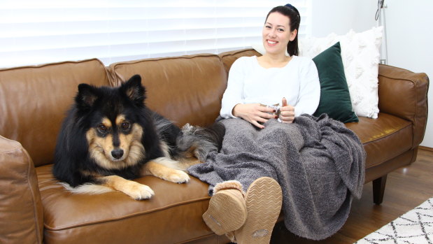 Manning resident Kate Erceg and her dog Loki on the best spot in the house on a winter's day.