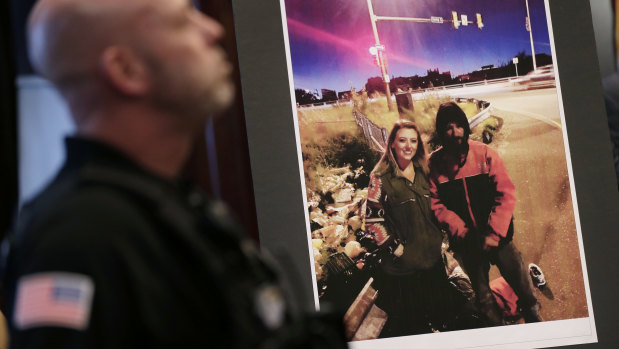 A picture of Katelyn McClure and Johnny Bobbitt is displayed during a police news conference.