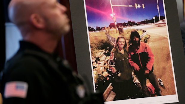 A picture of Katelyn McClure and Johnny Bobbitt is displayed during a police news conference.