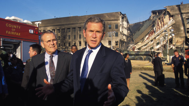 President George W. Bush and Secretary of Defence Donald Rumsfeld visit the Pentagon to view the damage the day after the September 11, 2001 terrorist attacks. The economic repercussions of the attacks continue to reverberate.