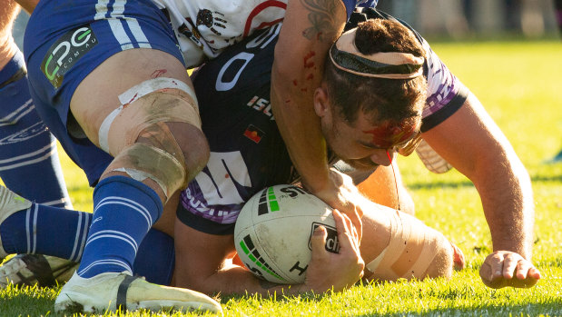 Jahrome Hughes continues after a clash of heads with teammate Dale Finucane at Belmore.