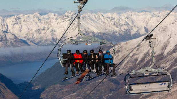 Skiers ride on the Coronet Express Chairlift at Coronet Peak, in Queenstown, New Zealand.