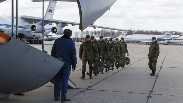 Russian military medical staff prepare to board a cargo plane that sent medical personnel and supplies to Italy last month.
