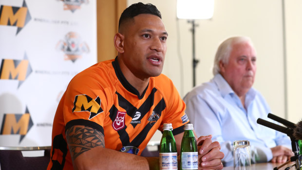 Israel Folau, pictured with backer Clive Palmer, said on Friday he was excited to return to the “grassroots level”.