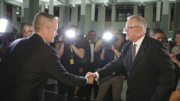 Corporate advisor John Connolly won the bidding on the charity auction for a drink with Bill Shorten, pictured here with Scott Morrison at Wednesday's Midwinter Ball.