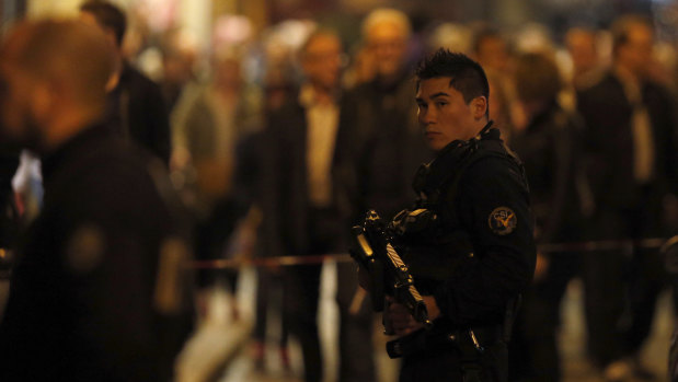 A police officer watches on after a knife attack in central Paris on Saturday.