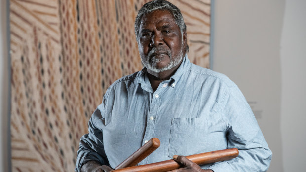 Artist Djambawa Marawili AM from Yilpara in the Northern Territory in front of his work 'Journey to America', 2018.